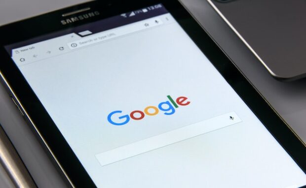 Close-up image of a smartphone displaying Google Assistant interface, showcasing how AI upgrades will optimize user interactions.